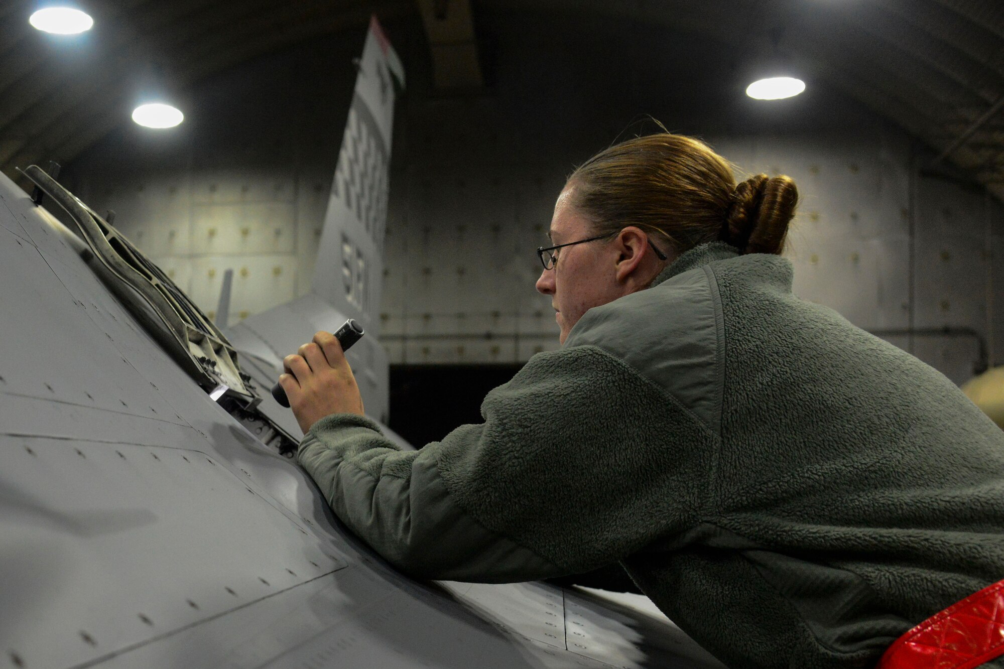 Senior Airman Berea Robinson, 36th Aircraft Maintenance Squadron F-16 Fighting Falcon avionics specialist, checks to see if rounds are properly set after being loaded during the Vigilant Ace 16 exercise on Osan Air Base, Republic of Korea, Nov. 2, 2015. Functional checks are made throughout the loading process, ensuring safe measures were taken throughout. (U.S. Air Force photo/Senior Airman Kristin High)