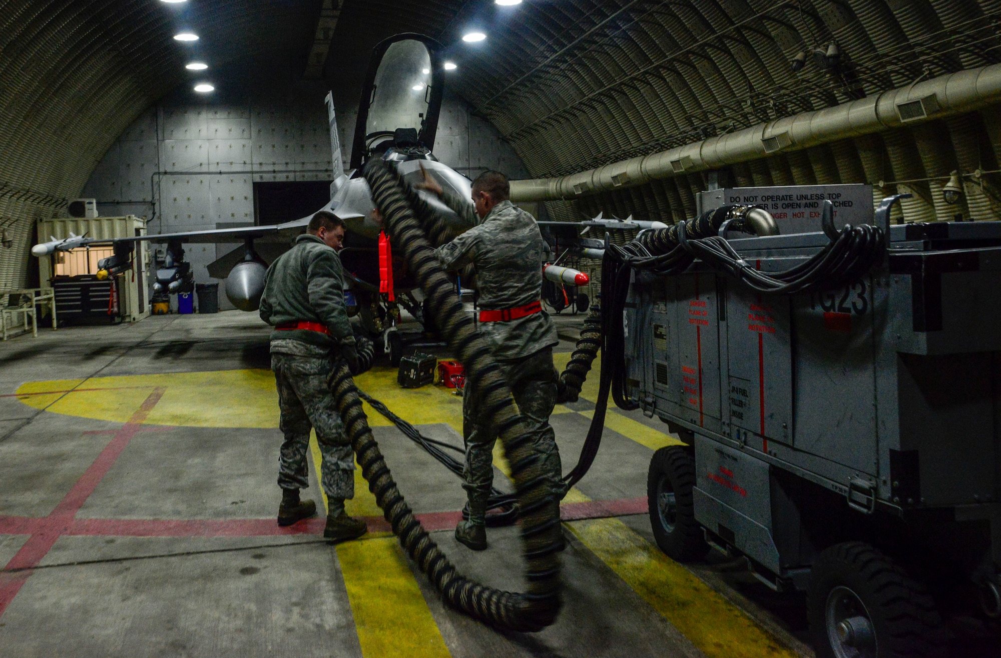 Airman 1st Class Austin Bryant and Senior Airman Jacob Ennis, 36th Aircraft Maintenance Squadron avionics specialists, prepare to reprogram a LANTIRN pod during the Vigilant Ace 16 exercise on Osan Air Base, Republic of Korea, Nov. 2, 2015. The LANTIRN is a system consisting of two pods which allow aircrew to fly their aircraft by day or night and in adverse meteorological conditions. (U.S. Air Force photo/Senior Airman Kristin High)