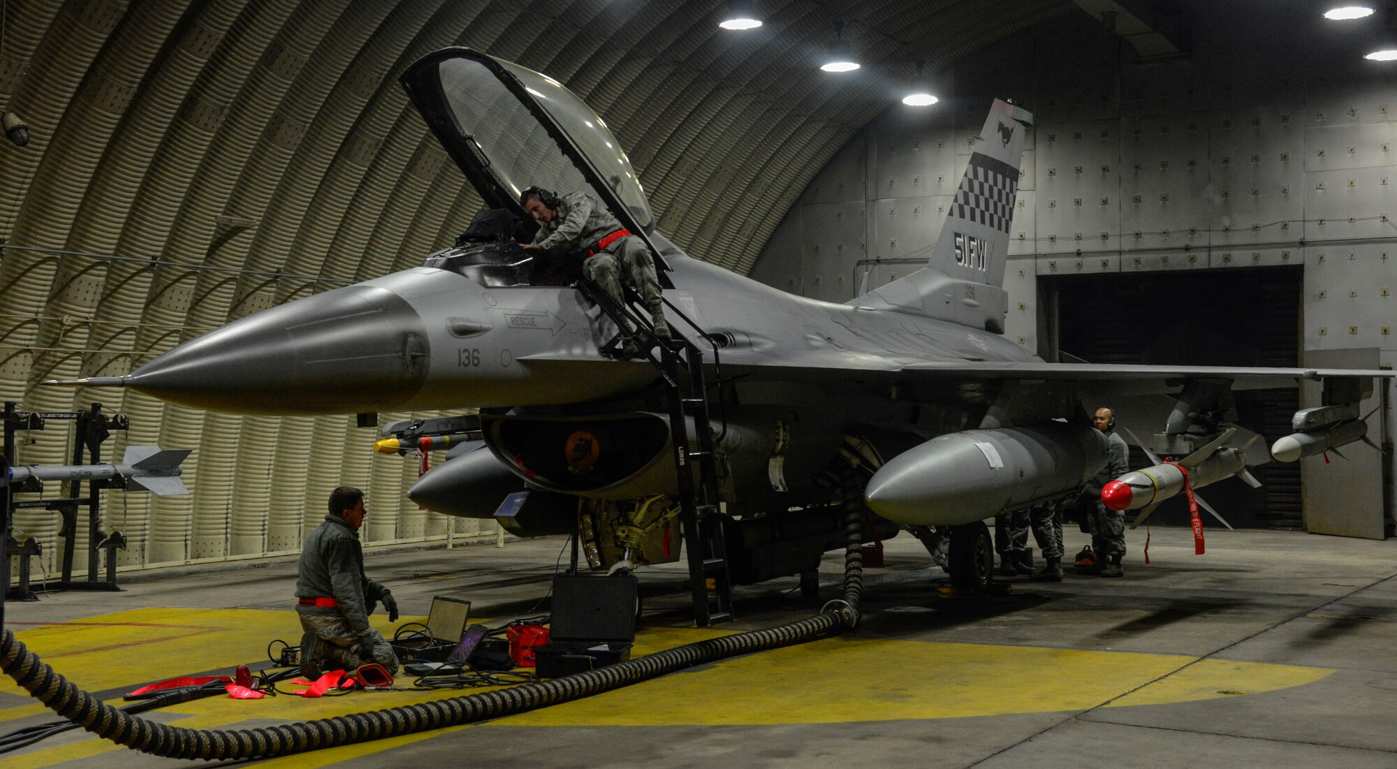Airmen from the 36th Aircraft Maintenance Squadron prepare an F-16 Fighting Falcon for mission capabilities during the Vigilant Ace 16 exercise on Osan Air Base, Republic of Korea, Nov. 2, 2015. The exercise is held throughout multiple military organizations on the Korean peninsula to assure the bond between the ROK and U.S. is maintained. The exercise allows ROK and U.S. forces to join in military training scenarios along with augmentees from Japan. (U.S. Air Force photo/Senior Airman Kristin High)