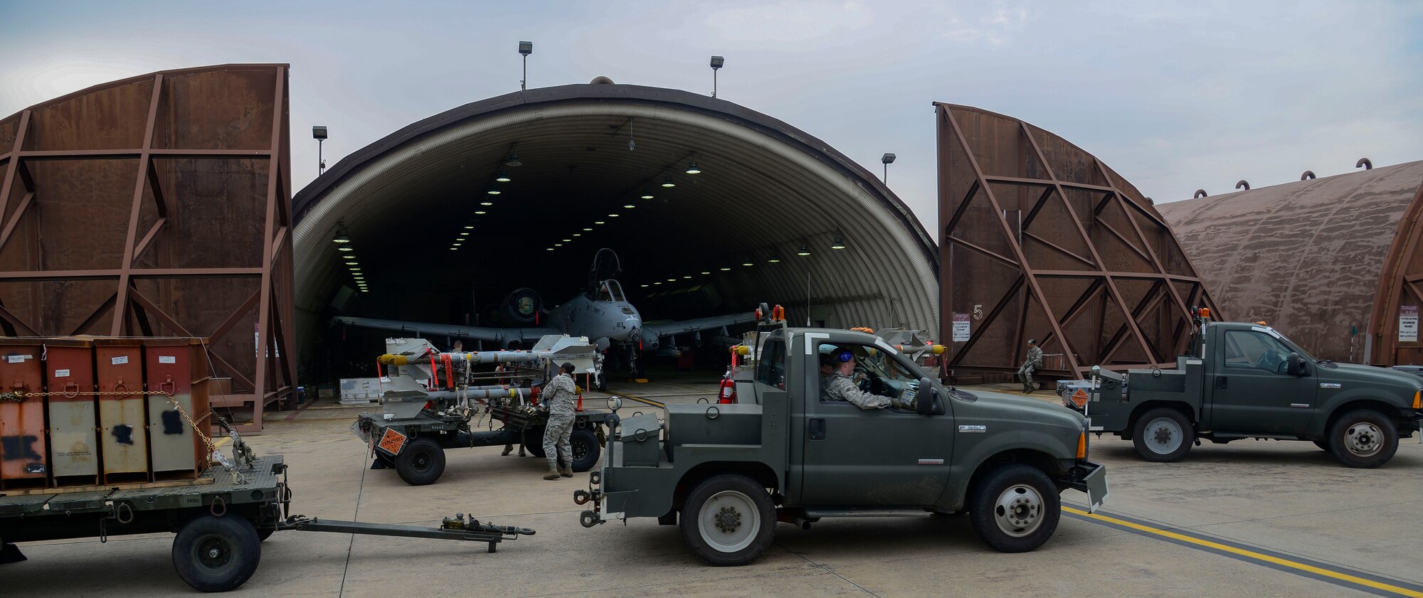Weapons load crew team Airmen from the 25th Aircraft Maintenance Unit prepare to load munitions onto A-10 Thunderbolt IIs during the Vigilant Ace 16 exercise on Osan Air Base, Republic of Korea, Nov. 1, 2015. The munitions Airmen can load up to 16,000 pounds of mixed ordnance onto the A-10 airframe. The A-10 is powered by two General Electric TF34-GE-100 turbofan engines producing 9,065 pounds of thrust each, and the A-10 is capable  of reaching speeds of 450 nautical miles per hour. (U.S. Air Force photo/Senior Airman Kristin High)