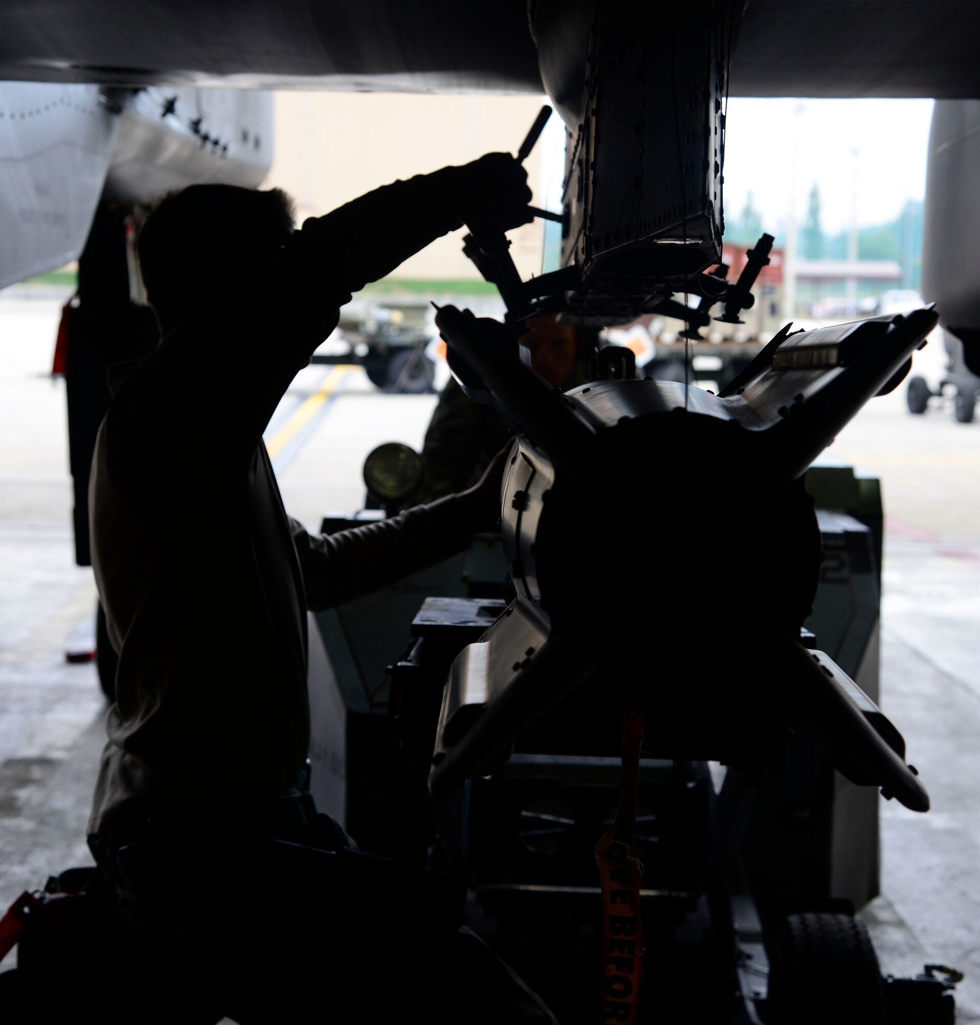 Staff Sgt. Christopher Uecker, 25th Aircraft Maintenance Unit weapons load crew team chief, tightens a guided bomb unit onto an A-10 Thunderbolt II during the Vigilant Ace 16 exercise on Osan Air Base, Republic of Korea, Nov. 1, 2015. The A-10 can hold up to 16,000 pounds of mixed ordnance, employing a wide variety of conventional munitions including general purpose bombs, cluster bomb units, laser guided bombs, joint direct attack munitions, rockets, illumination flares and the 30 millimeter cannon, capable of firing 3,900 rounds per minute. (U.S. Air Force photo/Senior Airman Kristin High)
