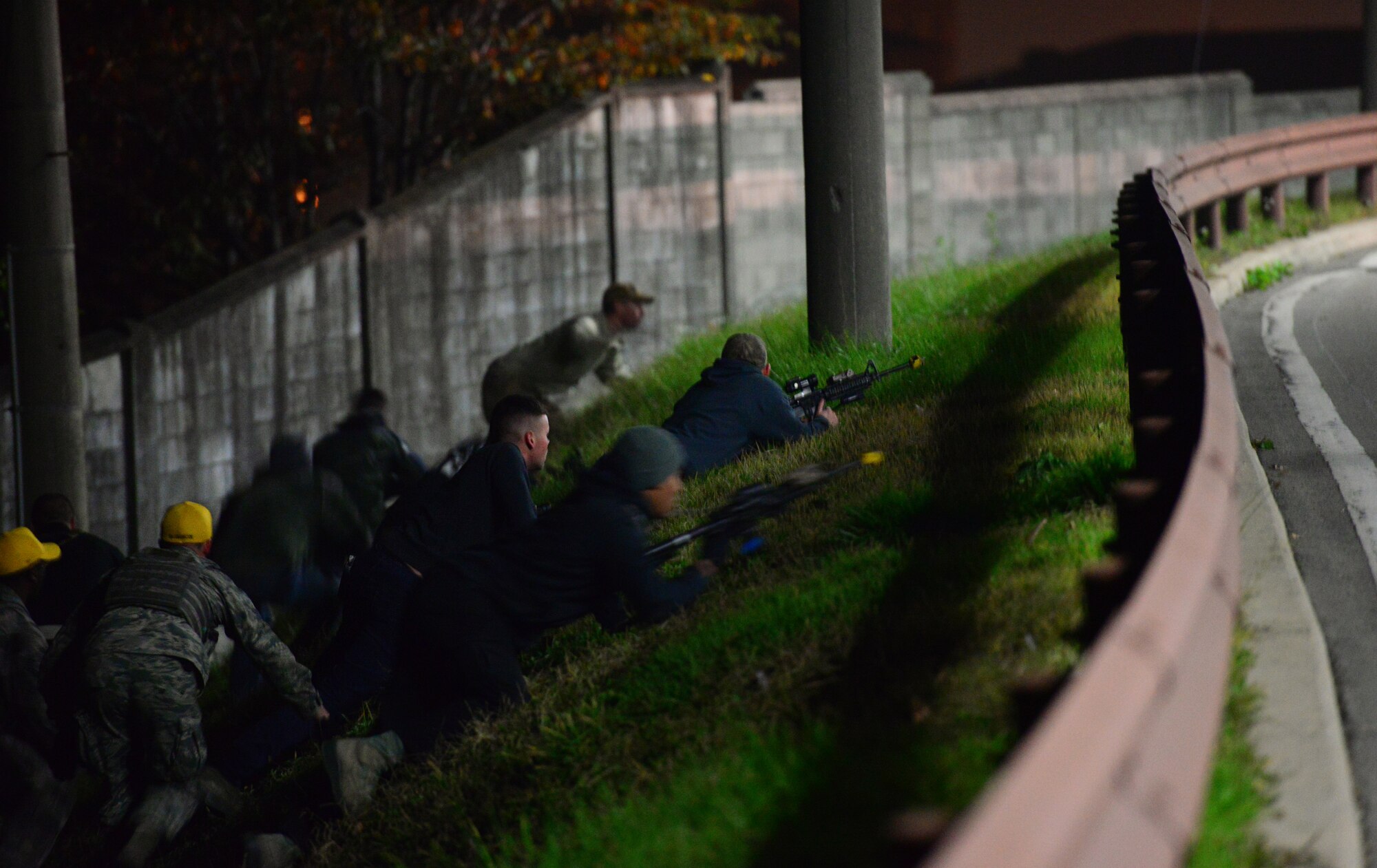Airmen from the 51st Security Forces Squadron, acting as opposing forces, slip into an ambush position during exercise Vigilant Ace 16 at Osan Air Base, Republic of Korea, Nov. 5, 2015. Ground attacks against defensive fighting positions are an important part of testing defensive capabilities and the response speed of base defenders. Vigilant Ace 16 is a U.S. and ROK combined exercise designed to enhance operational and tactical level coordination through combined, joint combat training. (U.S. Air Force photo/Staff Sgt. Amber Grimm)