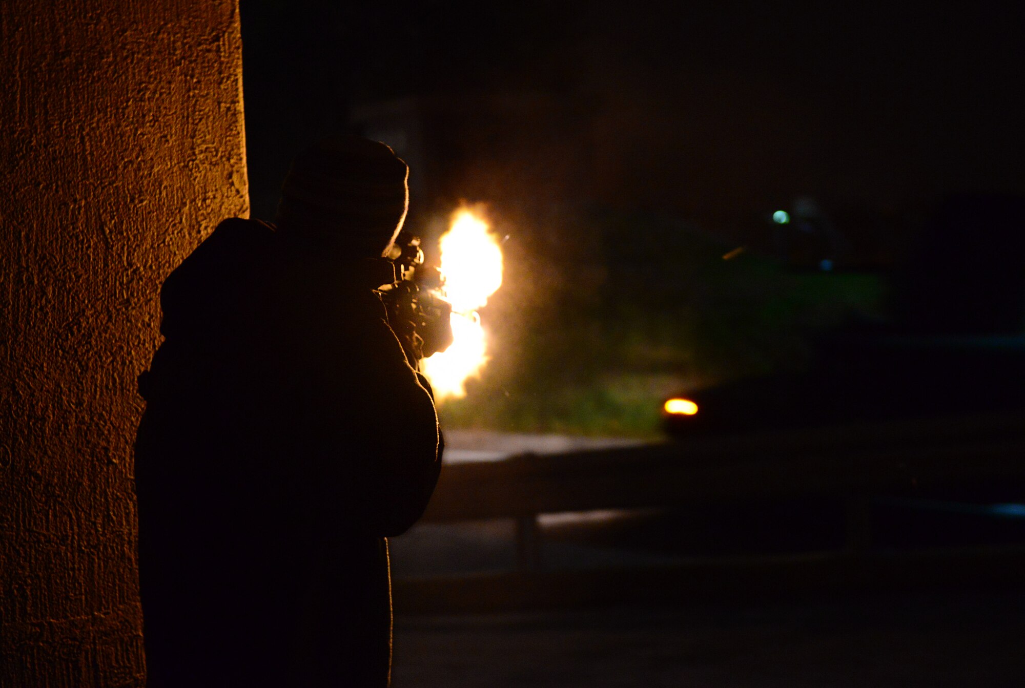 Airman 1st Class Benjamin Woolley, 51st Security Forces Squadron member, acting as opposing forces, fires on base defenders responding as reinforcements during exercise Vigilant Ace 16 at Osan Air Base, Republic of Korea, Nov. 5, 2015. Vigilant Ace 16 is a U.S. and ROK combined exercise designed to enhance operational and tactical level coordination through combined, joint combat training. (U.S. Air Force photo/Staff Sgt. Amber Grimm)