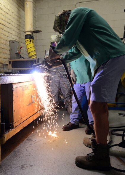 Connor Murphy, Arizona Coyotes defenseman, practices plasma welding at the 56th Logistics Readiness Squadron November 4, 2015, at Luke Air Force Base, Arizona. Murphy visited Luke for Veterans Day to speak with Airmen and see what they do on a daily basis serving in the Air Force. (U.S. Air Force photo by Staff Sgt. Marcy Copeland)