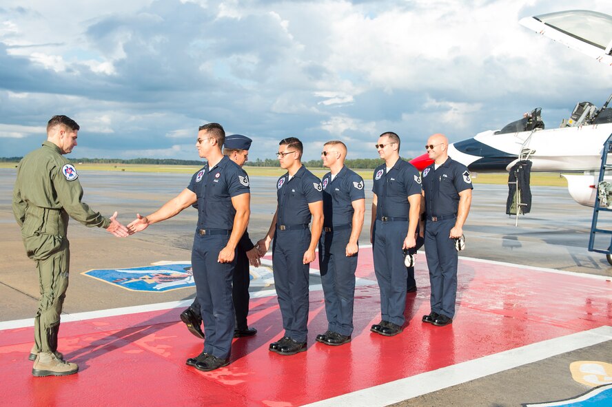 Lt. Chad Roe, Valdosta firefighter and Moody’s Hometown Hero, greets the U.S. Air Force Thunderbirds crew before his hero flight in a U.S. Air Force Thunderbirds F-16D Fighting Falcon, Nov. 5, 2015, at Moody Air Force Base, Ga. The local community named Roe “Firefighter of the Year,” and he received a congratulatory flight with the Thunderbirds for his contributions to the community. (U.S. Air Force photo by Senior Airman Ceaira Tinsley/Released)