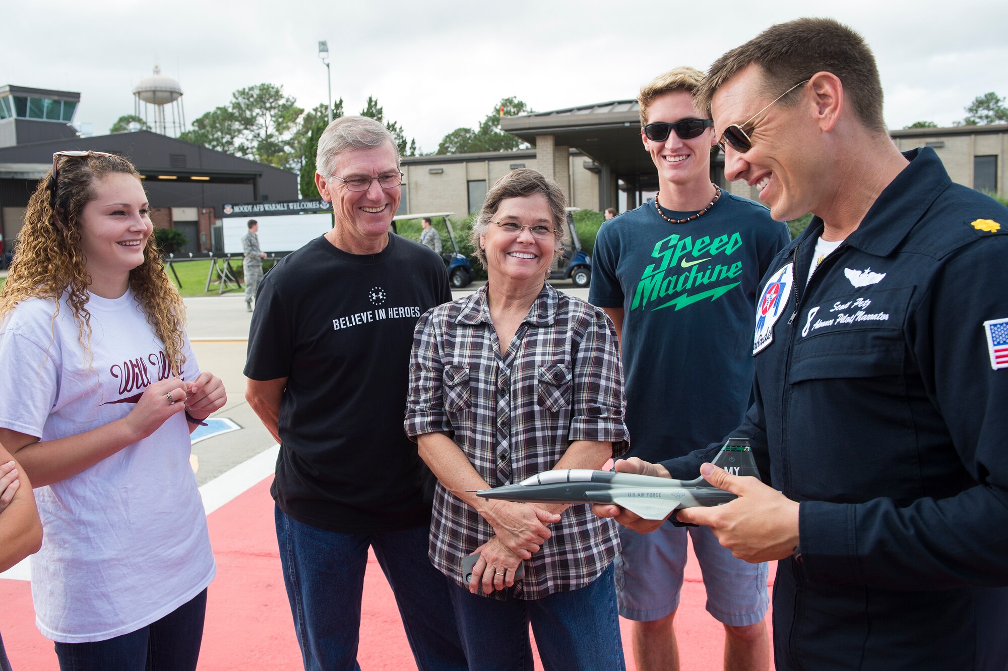 The family of Valdosta firefighter and Moody’s Hometown Hero, Lt. Chad Roe, shares a laugh with U.S. Air Force Maj. Scott Petz, Thunderbird No. 8, before Roe’s hero flight in an F-16D Fighting Falcon, Nov. 5, 2015, at Moody Air Force Base, Ga. The Hometown Hero flight is designed to showcase the unique capabilities of the Thunderbirds to a well-respected member of the local community. (U.S. Air Force photo by Senior Airman Ceaira Tinsley/Released)
