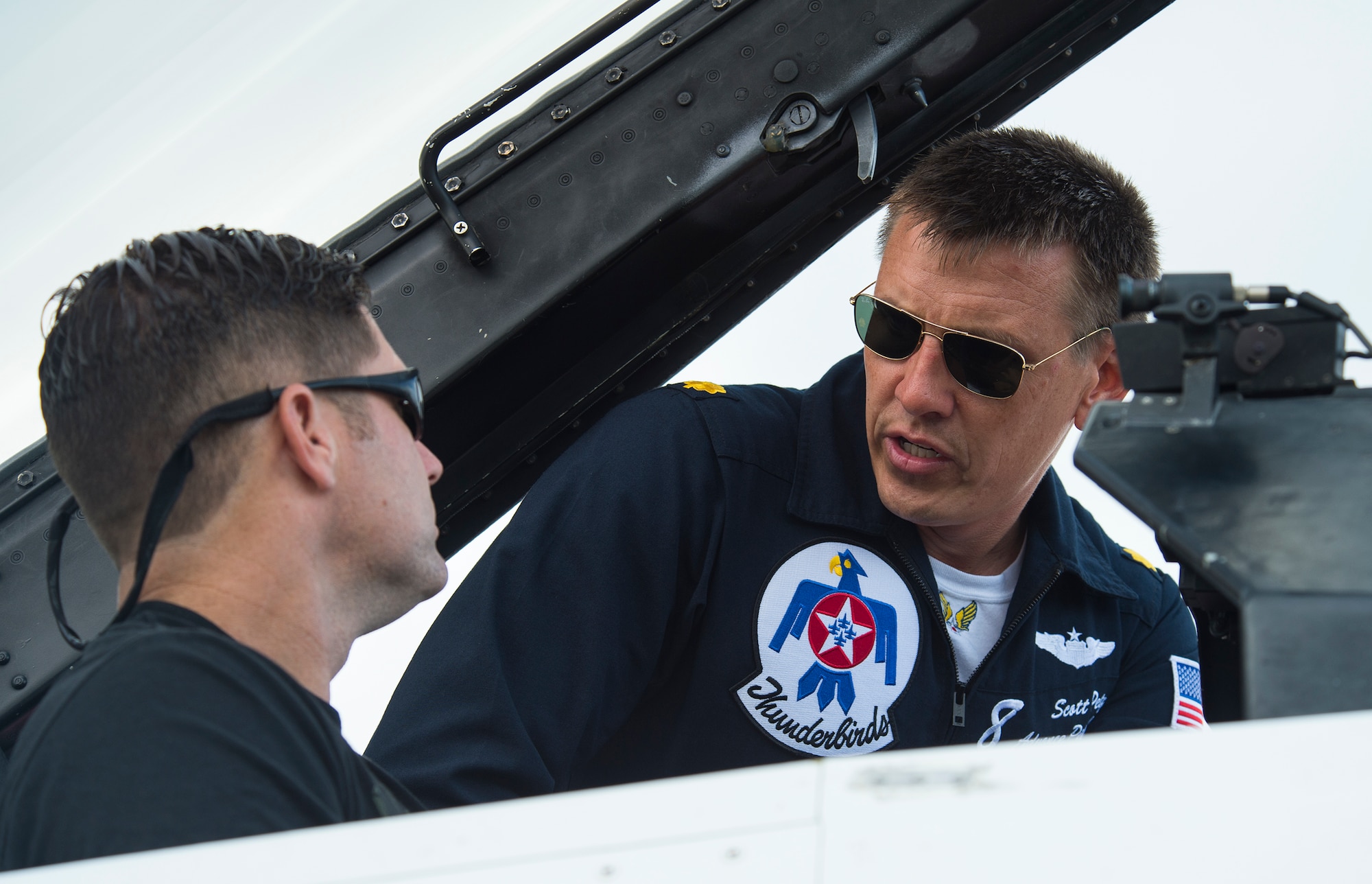 Valdosta firefighter and Moody Hometown Hero, Lt. Chad Roe, receives a tour of an F-16D Fighting Falcon from U.S. Air Force Maj. Scott Petz, Thunderbird No. 8, before Roe’s flight with the U.S. Air Force Thunderbirds, Nov. 5, 2015, at Moody Air Force Base, Ga. The local community named Roe “Firefighter of the Year” and he received a flight with the Thunderbirds for his contributions to the community. (U.S. Air Force photo by Senior Airman Ceaira Tinsley/Released)