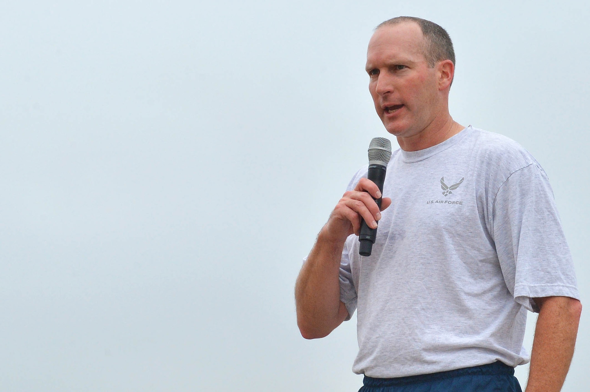 U.S. Air Force Col. Stephen Jost, the commander of the 20th Fighter Wing, signals the beginning of the wing run at Shaw Air Force Base, S.C., Nov. 6, 2015. The run was established to build camaraderie among all 20th FW Airmen and to emphasize how important each Airman is to completing the mission. (U.S. Air Force photo by Senior Airman Diana Cossaboom)