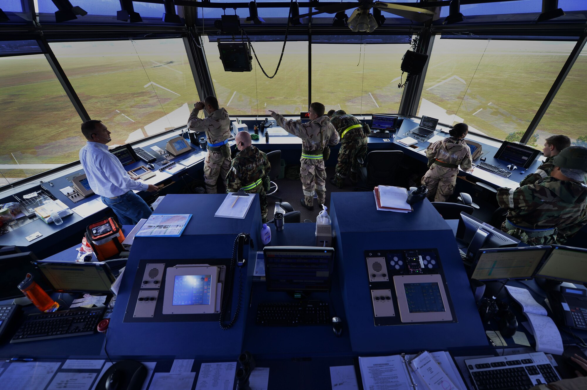 U.S. Air Force Airmen assigned to the 20th Operations Support Squadron scan the flightline before F-16CM Fighting Falcons take off during operational readiness exercise Weasel Victory 16-02, at Shaw Air Force Base, S.C., Nov. 3, 2015. The four-day ORE was used to evaluate the combat capabilities and readiness of the 20th Fighter Wing. (U.S. Air Force photo by Senior Airman Michael Cossaboom)