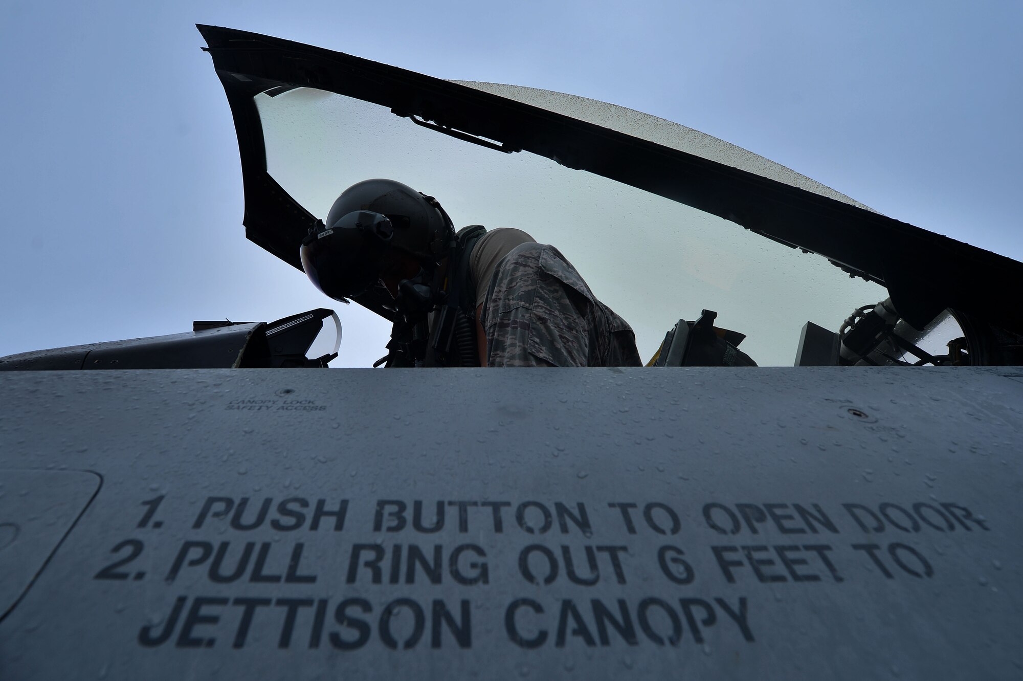A U.S. Air Force Airman hops into the cockpit of an F-16CM Fighting Falcon during operational readiness exercise Weasel Victory 16-02, at Shaw Air Force Base, S.C., Nov. 3, 2015. The ORE tested the combat capabilities of the 20th Fighter Wing through a variety of simulated scenarios and events. (U.S. Air Force photo by Senior Airman Michael Cossaboom)