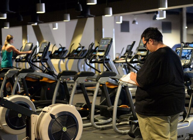 Eric Reyes, 99th Force Support Squadron fitness specialist, performs a head count at the Warrior Fitness Center on Nellis Air Force Base, Nev., Nov. 3, 2015. A head count is performed every hour for accountability. (U.S. Air Force photo by Airman 1st Class Rachel Loftis)