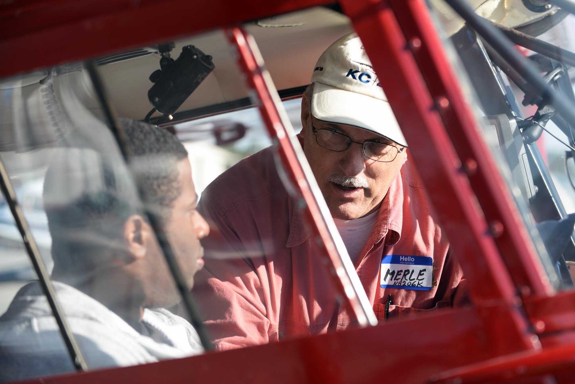 Merle Bingham (right) briefs Senior Airman Marcus Jenkins, 4th Operations Support Squadron air traffic controller, prior to takeoff during the Scare-A-Controller event, Oct. 31, 2015, at Wayne Executive Jetport in Goldsboro, North Carolina. The Goldsboro Wayne Aviation Association and the Seymour Johnson Flying Club teamed up to fly more than 50 individuals from the base. (U.S. Air Force photo/Senior Airman John Nieves Camacho)