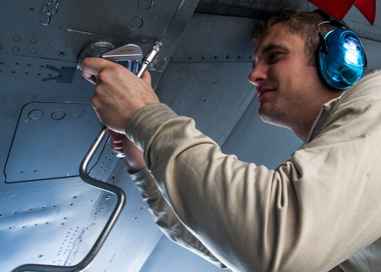Staff Sgt. Brian Cormier, a crew chief with the 54th Aircraft Maintenance Squadron at Holloman, prepares an F-16 Fighting Falcon for aircraft purification Nov. 4. Holloman Airmen performed this process for the first time on an F-16 on Nov. 3.  The goal of Aircraft Purification is to increase aircraft system reliability, reduce maintenance costs and reduce the waste associated with standard fluid changes. (U.S. Air Force photo by Airman 1st Class Emily A. Kenney/Released)  