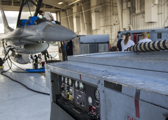 Airmen from the 54th Aircraft Maintenance Squadron at Holloman prepare an F-16 Fighting Falcon for aircraft purification Nov. 4, at Holloman Air Force Base, N.M. Aircraft purification is the process in which water, air and contaminant particles are removed from the hydraulic fluid in an aircraft. Holloman Airmen performed this process for the first time on an F-16 on Nov. 3. (U.S. Air Force photo by Airman 1st Class Emily A. Kenney/Released)