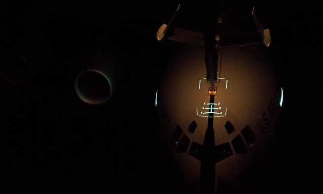 A U.S. Air Force C-17 Globemaster III receives fuel from a KC-10 Extender while flying over the Atlantic Ocean during Trident Juncture 2015, Nov. 3, 2015. Without the refueling capability of the KC-10, the C-17s would not have enough fuel to make it all the way to Spain from the U.S. (U.S. Air Force photo by Staff Sgt. Douglas Ellis)