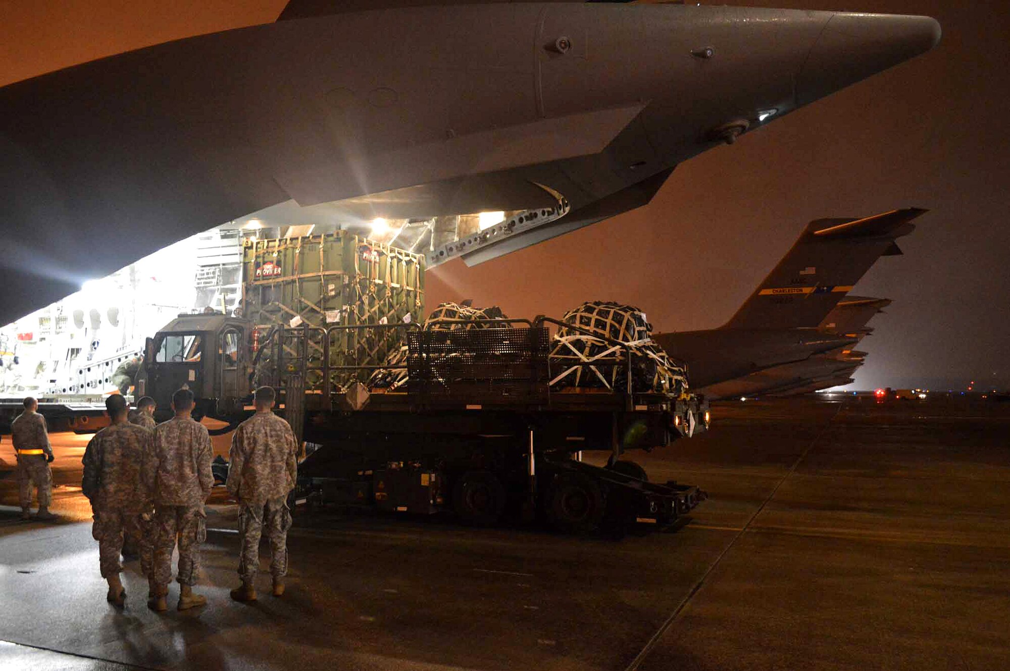 U.S. Army paratroopers from the 2nd Brigade Combat Team, 82nd Airborne Division, load onto U.S. Air Force C-17 Globemaster III aircraft during exercise Ultimate Reach Nov. 3, 2015, Pope Army Airfield, N.C. Eighteenth Air Force units, partnered with the Army's 82nd Airborne Division, are participating in Exercise Ultimate Reach Nov. 2-8. This iteration of Ultimate Reach partners with NATO Exercise Trident Juncture, currently being held in locations across Europe. C-17 crews from Joint Base Charleston, S.C., Joint Base Lewis-McChord, Wash., and Joint Base Elmendorf-Richardson, Alaska, will fly more than 500 paratroopers across the Atlantic to conduct a joint forcible entry exercise over Zaragoza, Spain. (U.S. Air Force photo/Marvin Krause)