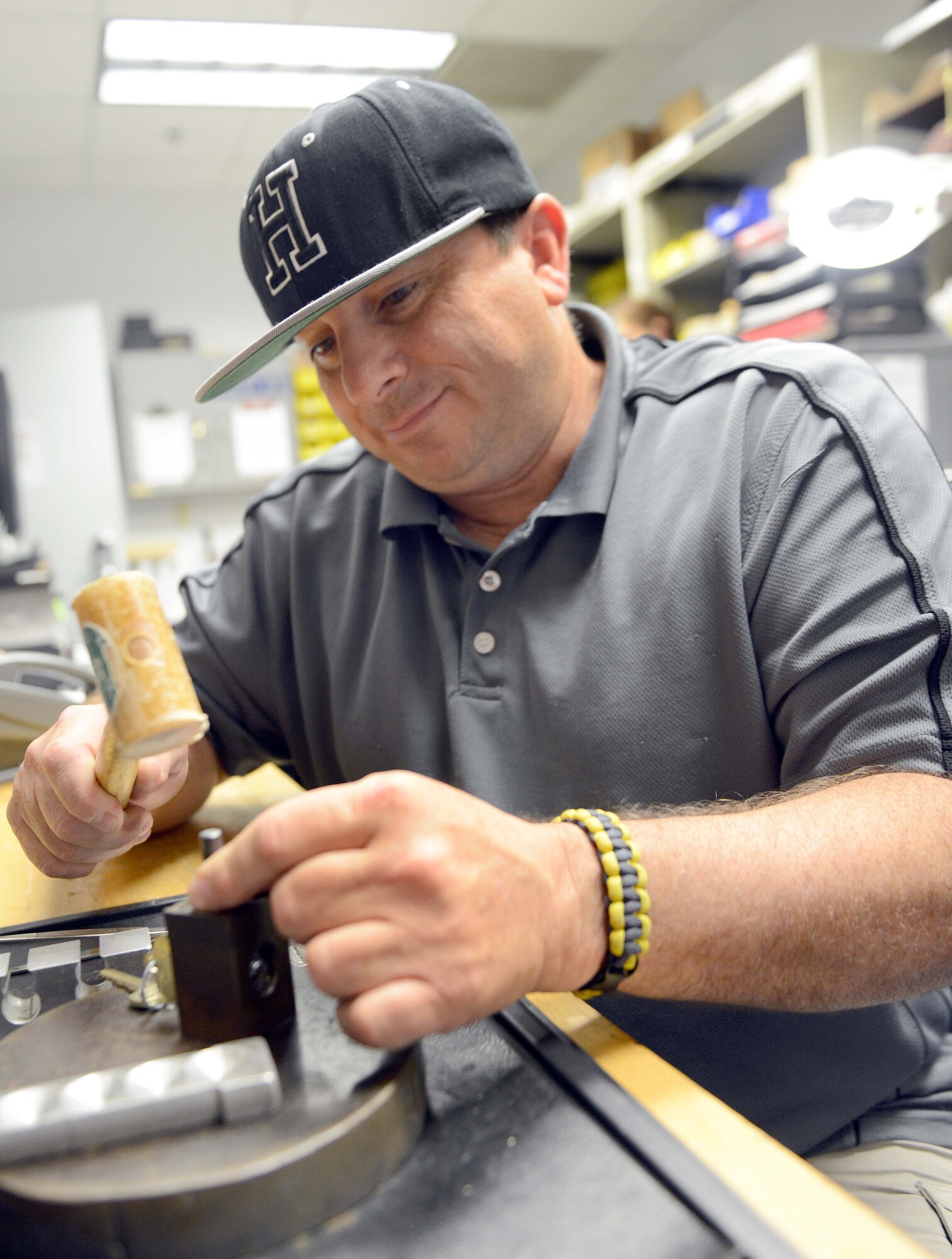 Barry Yuill, 78th Civil Engineering Squadron locksmith, pins cores for locks at the squadron’s key shop in Bldg. 1555. Because his work takes him all over base, most of his work is accomplished inside a mobile truck. (U.S. Air Force photo by Tommie Horton)