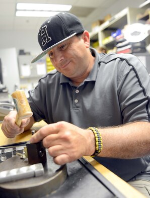 Barry Yuill, 78th Civil Engineering Squadron locksmith, pins cores for locks at the squadron’s key shop in Bldg. 1555. Because his work takes him all over base, most of his work is accomplished inside a mobile truck. (U.S. Air Force photo by Tommie Horton)