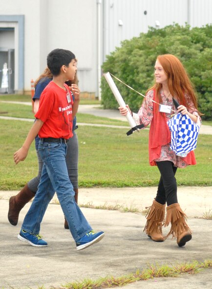 Jose Ramirez, and Haley Layton, Porter Elementary 5th graders, walk to the museum amphitheater where their rockets were launched. (U.S. Air Force photo by Misuzu Allen)