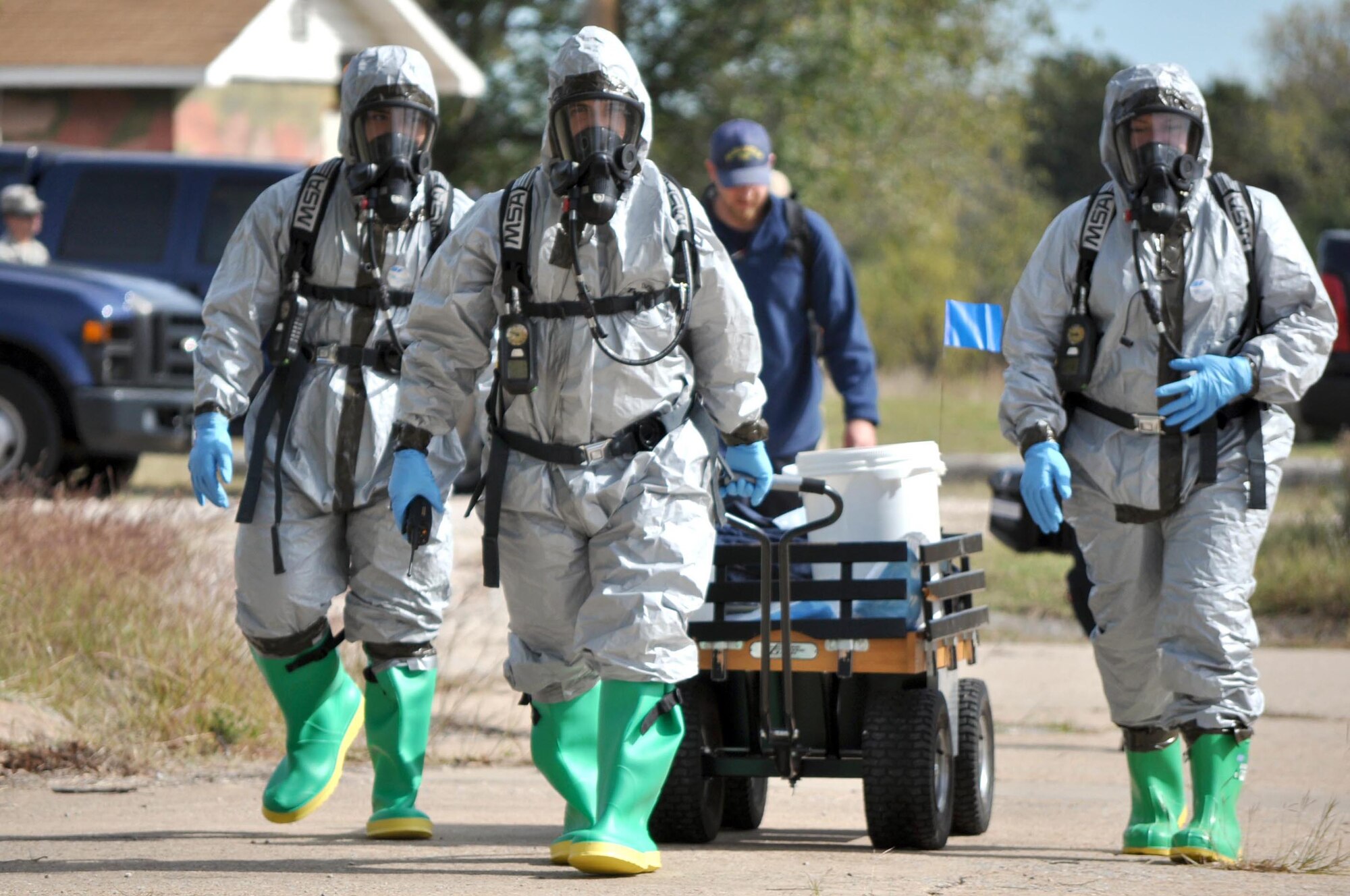 From left, Staff Sgt. Richard Melton and Airman 1st Class Leylan Umblas, 72nd Aerospace Medicine Squadron’s Bioenvironmental Engineer Flight, and Lisa Kuefler, from the 72nd Air Base Wing Civil Engineering Directorate’s Emergency Management Flight, prepare to enter the incident site during a task evaluation of the 72nd ABW’s Wing Inspection Team’s ability to develop and run an evaluation of a Chemical, Biological, Radiological and Nuclear exercise. The evaluation was part of an Air Force Materiel Command Inspector General Unit Effectiveness Inspection that began Oct. 26 and ends today. (Air Force photo by Marlin Zimmerman/Released)