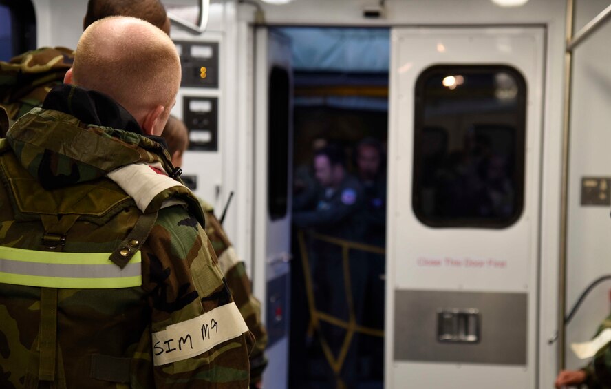 U.S. Air Force Airmen with the 35th Medical Group wait to board a KC-135 Stratotanker at Misawa Air Base, Japan, Nov. 4, 2015. The Airmen boarded the aircraft to perform an aeromedical evacuation as part of exercise Vigilant Ace 16. (U.S. Air Force photo by Airman 1st Class Jordyn Fetter/Released)