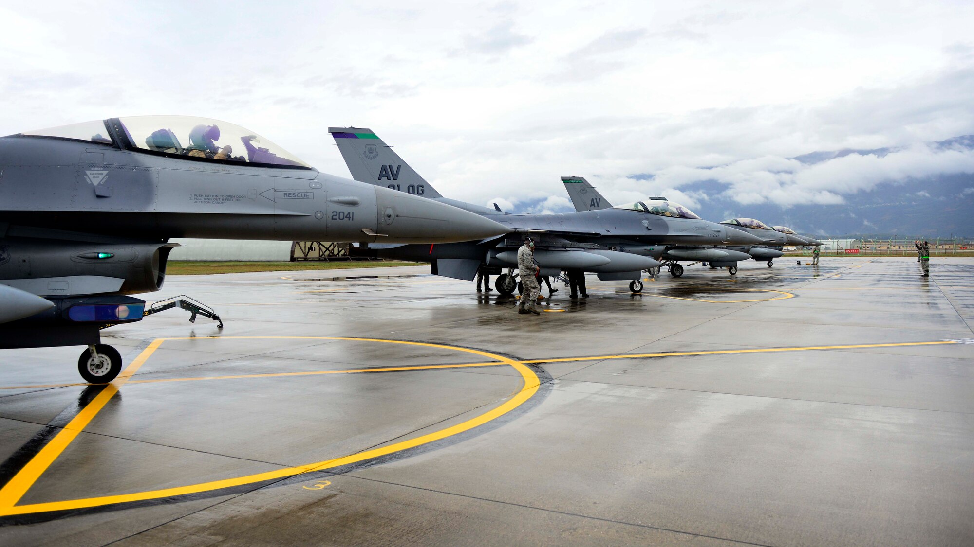 U.S. Air Force F-16 Fighting Falcons from the 555th Fighter Squadron arrive Oct. 29, 2015, at Aviano Air Base, Italy. The 555th FS and Aircraft Maintenance Unit deployed more than 300 maintenance and support personnel in support of Operation New Dawn. (U.S. Air Force photo by Senior Airman Areca T. Bell/Released)