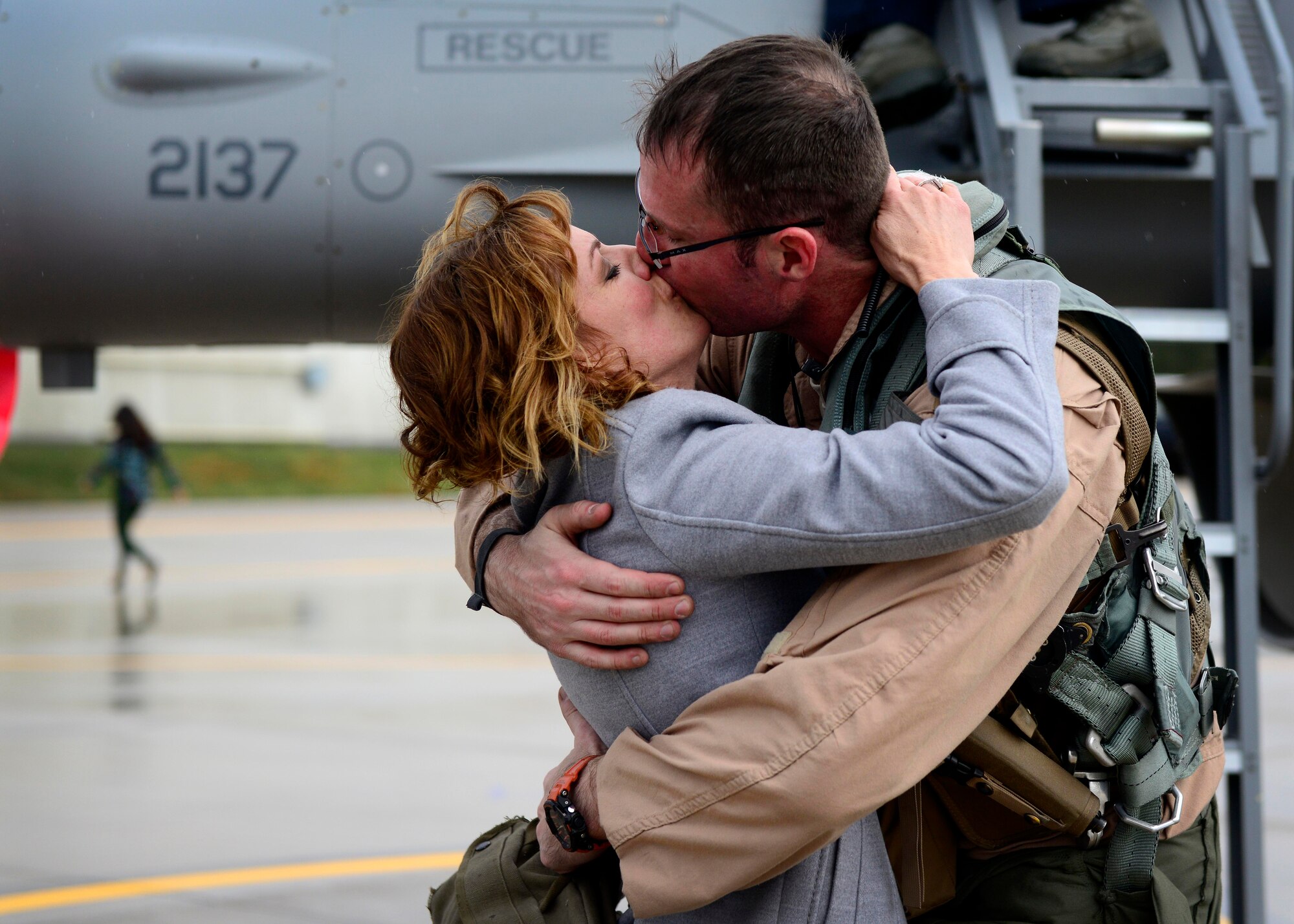 Family members welcome back 555th Fighter Squadron and Aircraft Maintenance Unit Airmen as they return from a deployment Oct. 29, 2015, at Aviano Air Base, Italy. The 555th FS and AMU deployed more than 300 maintenance and support personnel in support of Operation New Dawn. (U.S. Air Force photo by Senior Airman Areca T. Bell/Released)