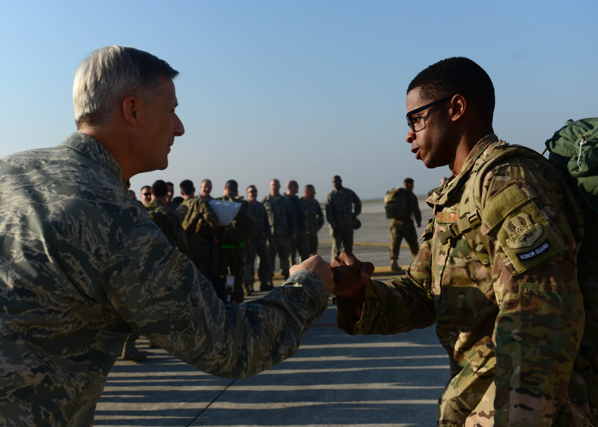 U.S. Air Force Col. Bryan Wolford, 31st Fighter Wing vice commander, welcomes back 555th Fighter Squadron and Aircraft Maintenance Unit Airmen after returning from a deployment, Nov. 3, 2015, at Aviano Air Base, Italy. The 555th FS and AMS deployed more than 300 maintenance and support personnel in support of Operation New Dawn. (U.S. Air Force photo by Senior Airman Austin Harvill/Released)