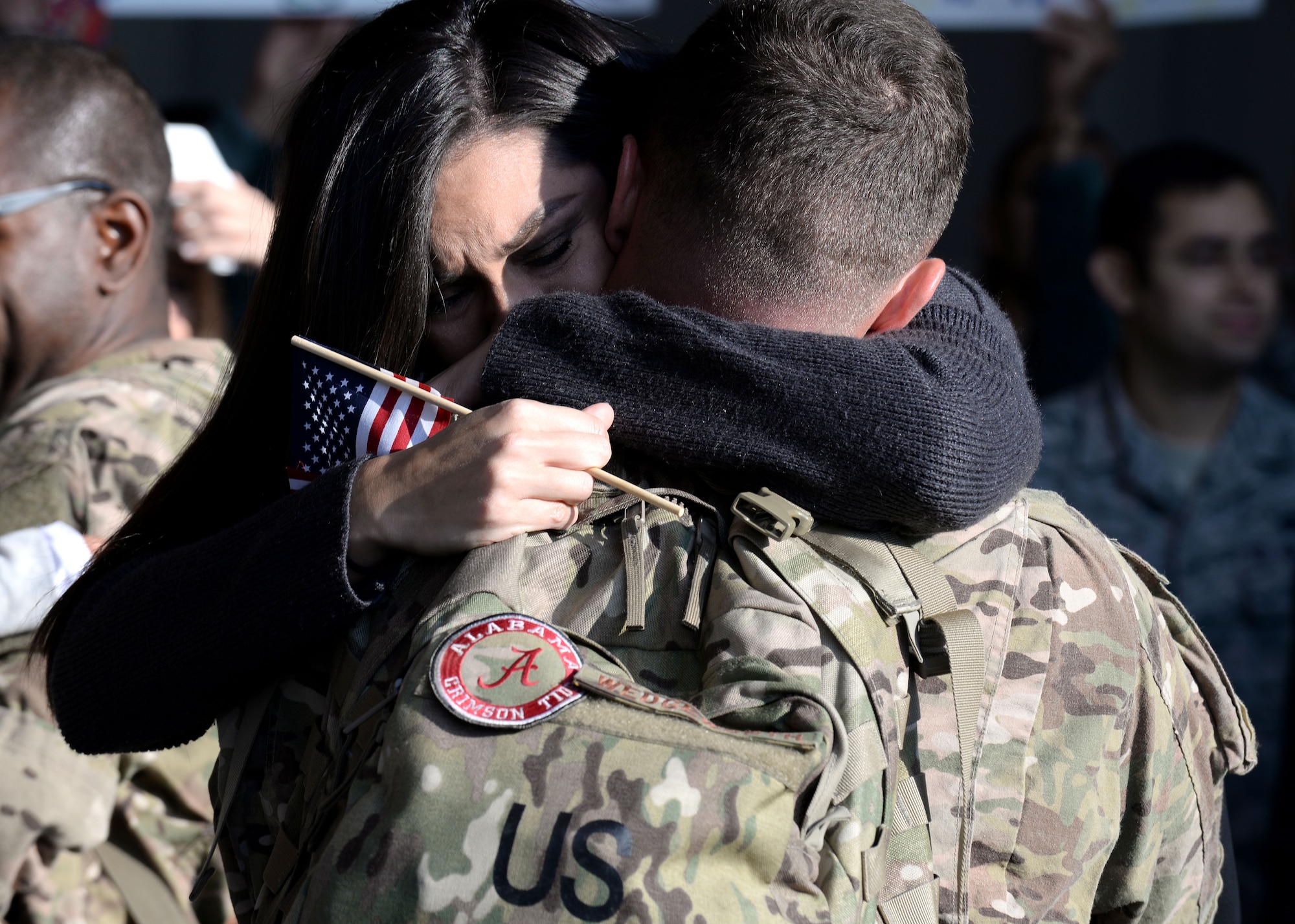 Family members welcome back 555th Fighter Squadron and Aircraft Maintenance Unit Airmen as they return from a deployment, Nov. 5, 2015, at Aviano Air Base, Italy. The 555th FS and AMU deployed more than 300 maintenance and support personnel in support of Operation New Dawn. (U.S. Air Force photo by Airman 1st Class Cary Smith/Released)