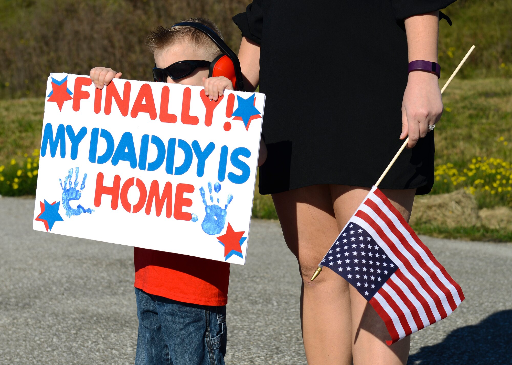 Family members welcome back 555th Fighter Squadron and Aircraft Maintenance Unit Airmen as they return from a deployment, Nov. 3, 2015, at Aviano Air Base, Italy. The 555th FS and AMU deployed more than 300 maintenance and support personnel in support of Operation New Dawn. (U.S. Air Force photo by Senior Airman Austin Harvill/Released)