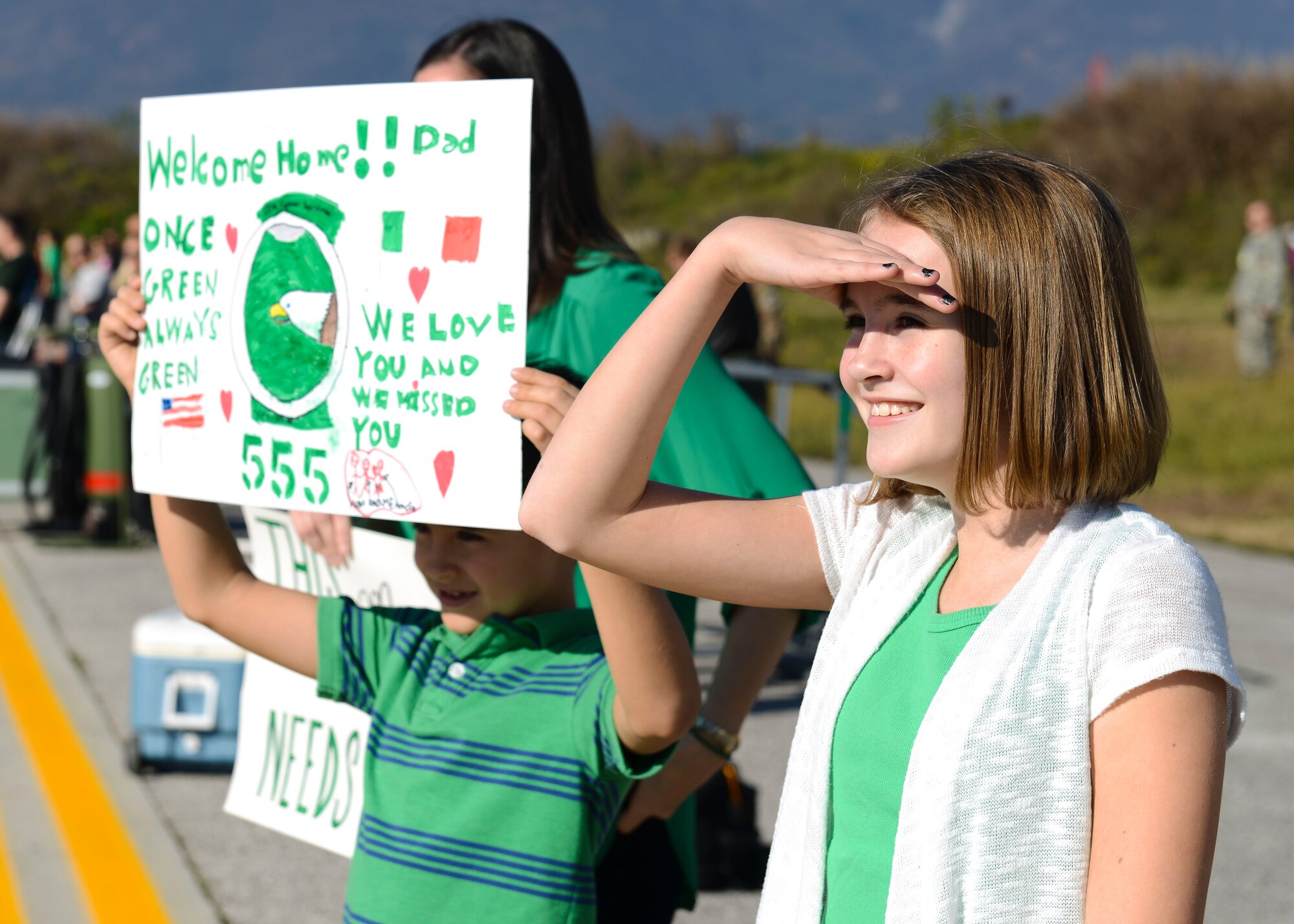 Family members welcome back 555th Fighter Squadron and Aircraft Maintenance Unit Airmen as they return from a deployment, Nov. 3, 2015, at Aviano Air Base, Italy. The 555th FS and AMU deployed more than 300 maintenance and support personnel in support of Operation New Dawn. (U.S. Air Force photo by Senior Airman Austin Harvill/Released)