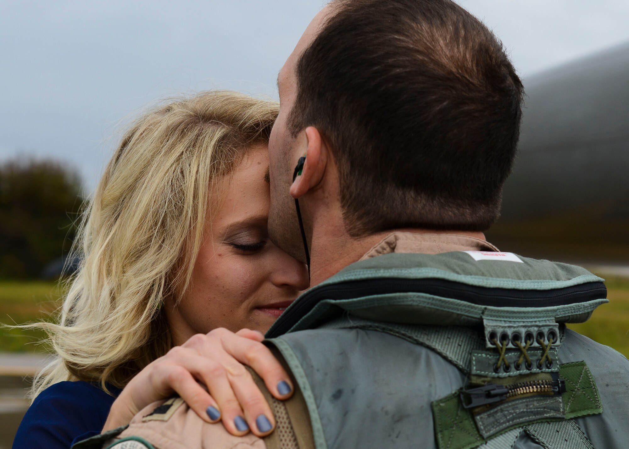 Family members welcome back 555th Fighter Squadron and Aircraft Maintenance Unit Airmen as they return from a deployment, Oct. 29, 2015, at Aviano Air Base, Italy. The 555th FS and AMU deployed more than 300 maintenance and support personnel in support of Operation New Dawn. (U.S. Air Force photo by Senior Airman Austin Harvill/Released)