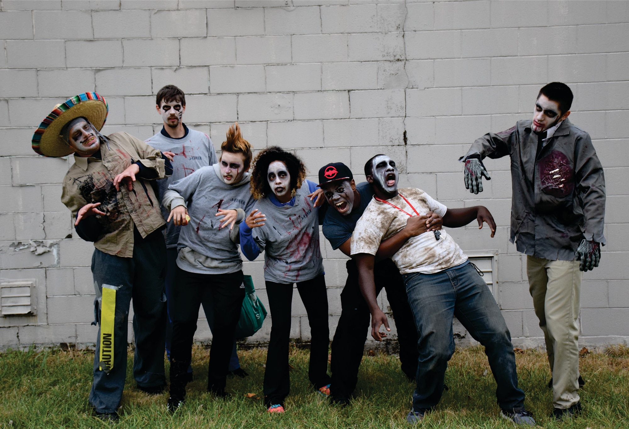 Wright-Patterson Fitness Programs' Inaugural Zombie Chase 5K October 30 attracted more than 100 runners, who were chased by a horde of zombies that included base personnel (from left): Ian Johnston, Luke Rankin, Kristin Willbanks, Jade Donnelly, Arthur Miller III, Ryan Cantrell and Benjamin Schmidt. (Air Force photo/Kristen S. Rice)
