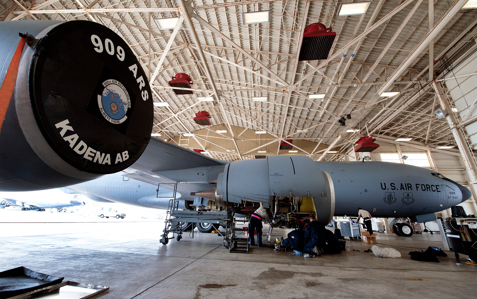 Members from the 909th Aircraft Maintenance Unit replace an F108 engine of a KC-135R Stratotanker, Nov. 4, 2015, at Kadena Air Base, Japan. In order to deliver rapid and precise air capabilities Airmen from the 909th AMU work hard to ensure the KC-135R is mission ready. (U.S. Air Force photo by Naoto Anazawa)