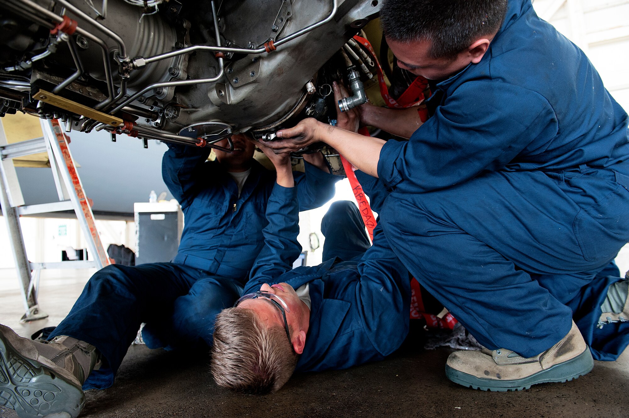 Airmen from the 909th Aircraft Maintenance Unit install a generator for the F108 engine, Nov. 4, 2015, at Kadena Air Base, Japan. The 909th AMU members replaced a KC-135R Stratotanker's engine and inspected to ensure that it would be mission ready. (U.S. Air Force photo by Naoto Anazawa)