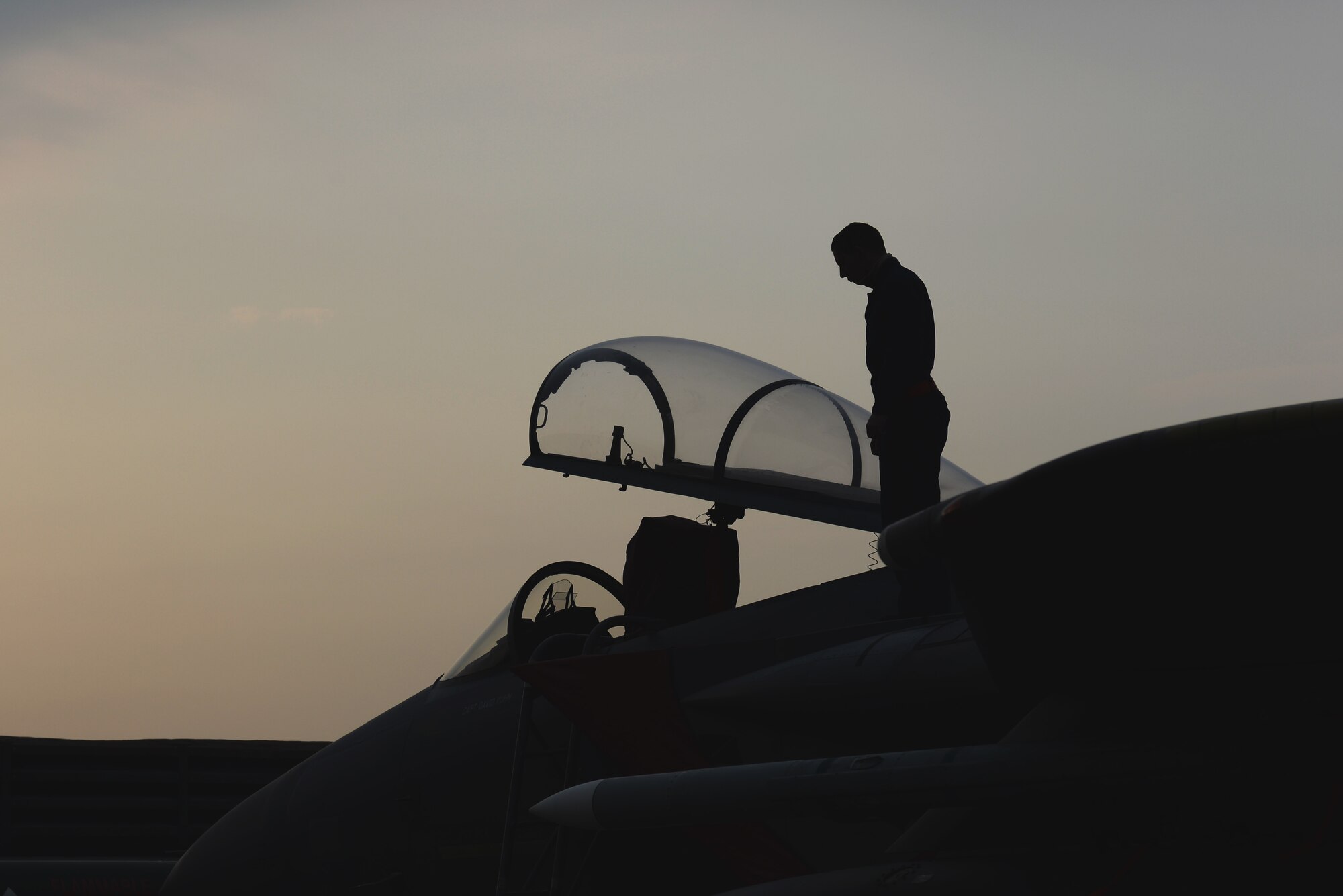 Senior Airman Maxwell Seley, 67th Fighter Squadron Aircraft Maintenance Unit crew chief, inspects the topside of an F-15 Eagle after it arrives from Kadena Air Base, Japan, in support of Vigilant Ace 16 Nov. 2, 2015, at Gwangju Air Base, Republic of Korea. Vigilant Ace 16 is a regularly scheduled training event designed to enhance the readiness of U.S. and Republic of Korea forces. (U.S. Air Force photo by Senior Airman Omari Bernard)