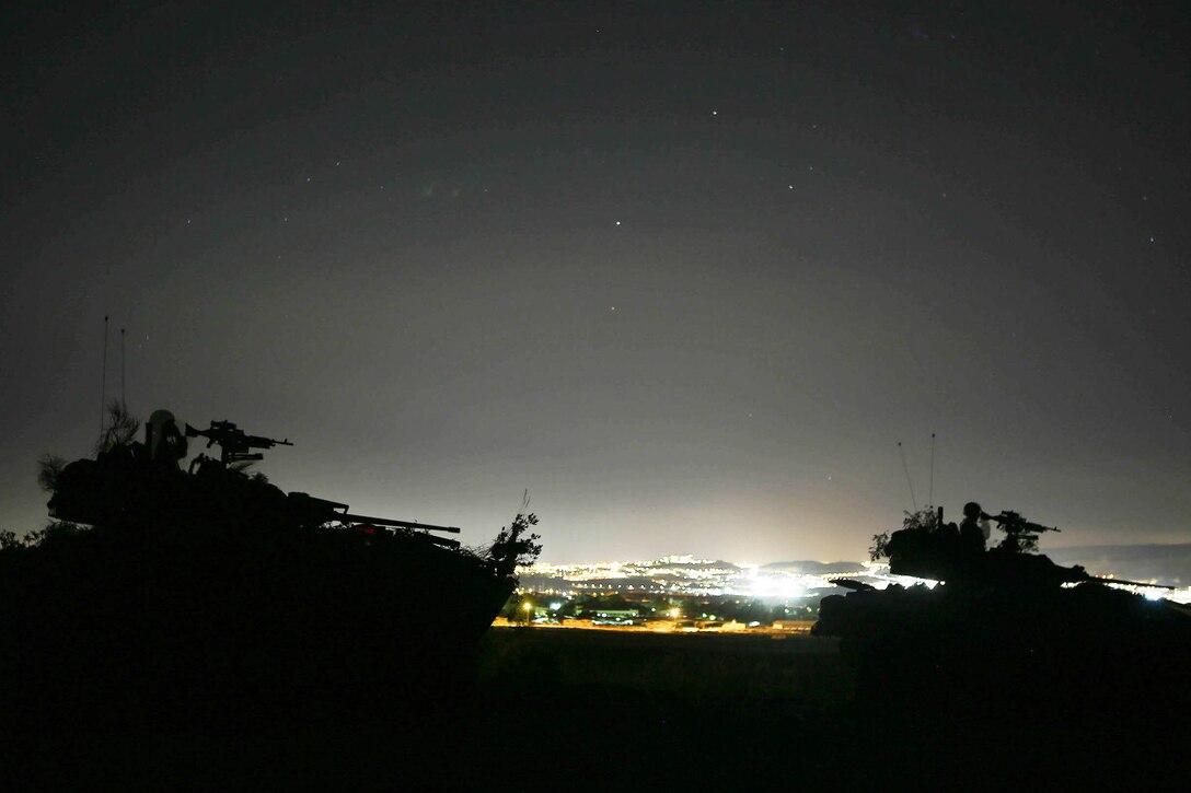 U.S. Marines look for the enemy during night exercises during Trident Juncture 2015 in Almería, Spain, Oct. 31, 2015. The exercise allows both sides to learn about each other’s tactics, techniques and operating procedures. The Marines are assigned to the 4th Marine Division's 4th Light Armored Reconnaissance Battalion. U.S. Marines Photo by Sgt. Sara Graham.