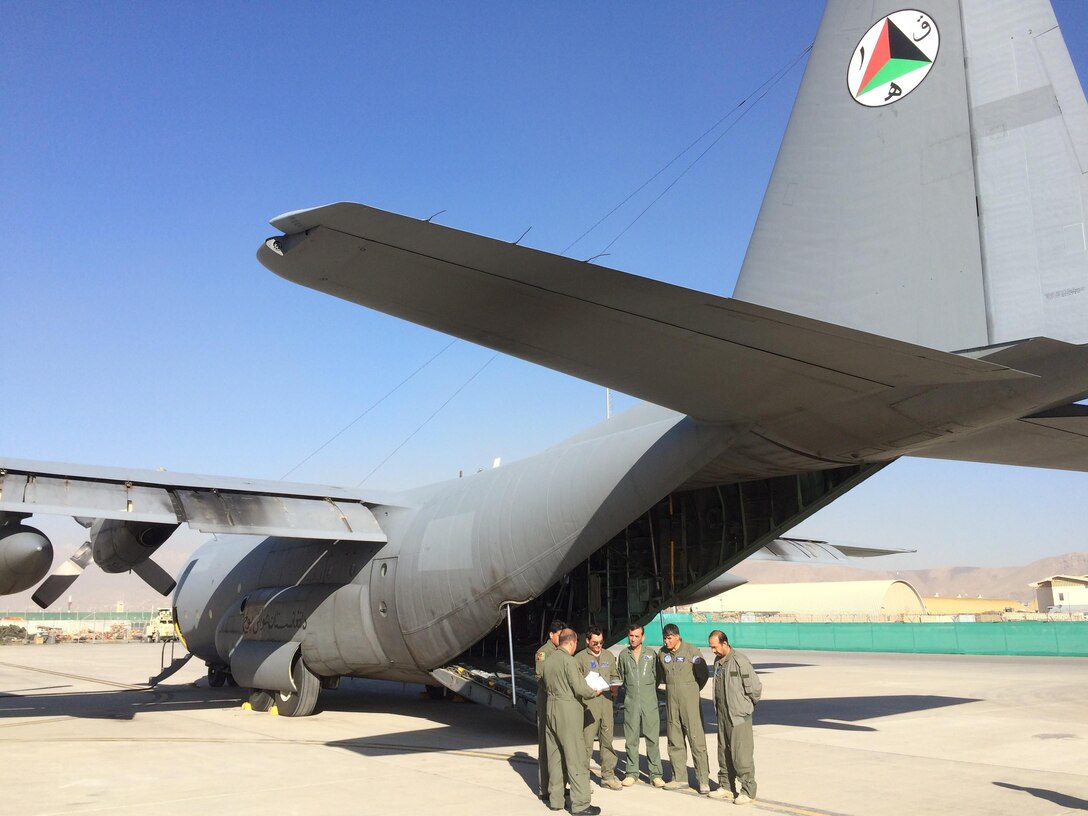 An all Afghan-led Afghan Air Force C-130 crew reached a major milestone on their path to sustainability Nov. 5, 2015, at Hamid Karzai International Airport, Kabul, Afghanistan. An Afghan aircrew walked out to their C-130 and briefed in preparation for their first-ever all-Afghan C-130 training sortie. After the briefing, the crew started engines and taxied out while being marshalled by an Afghan maintainer. (U.S. Air Force photo by Lt. Col. Michael Morales/released)