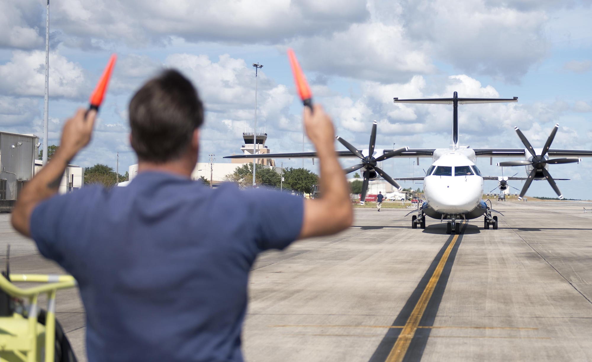 A contracted maintainer marshals in a C-146 Wolfhound after a sortie at Duke Field, Fla., Oct. 21.  The Air Force Special Operations Wing aircraft are used specifically in the training and operation of the 919th Special Operations Wing’s nonstandard aviation mission.  (U.S. Air Force photo/Tech. Sgt. Sam King)