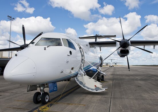 A C-146 Wolfhound waits for its next mission as another aircraft begins engine warmup at Duke Field, Fla., Oct. 21.  The Air Force Special Operations Wing aircraft are used specifically in the training and operation of the 919th Special Operations Wing’s nonstandard aviation mission.  (U.S. Air Force photo/Tech. Sgt. Sam King)