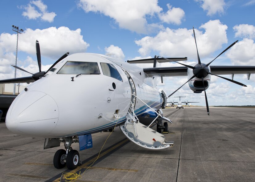 A C-146 Wolfhound waits for its next mission as another aircraft begins engine warmup at Duke Field, Fla., Oct. 21.  The Air Force Special Operations Wing aircraft are used specifically in the training and operation of the 919th Special Operations Wing’s nonstandard aviation mission.  (U.S. Air Force photo/Tech. Sgt. Sam King)