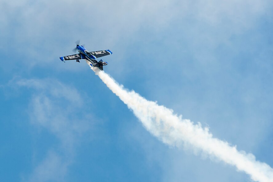Rob Holland, pilot of the Window World MXS-RH, performs a roll during the Thunder Over South Georgia, Nov. 7, 2015, at Moody Air Force Base, Ga. The MXS-RH is a single-seat, competition and all carbon-fiber aircraft capable of reaching 14 positive and negative Gs. (U.S. Air Force photo by Airman 1st Class Kathleen D. Bryant/Released)