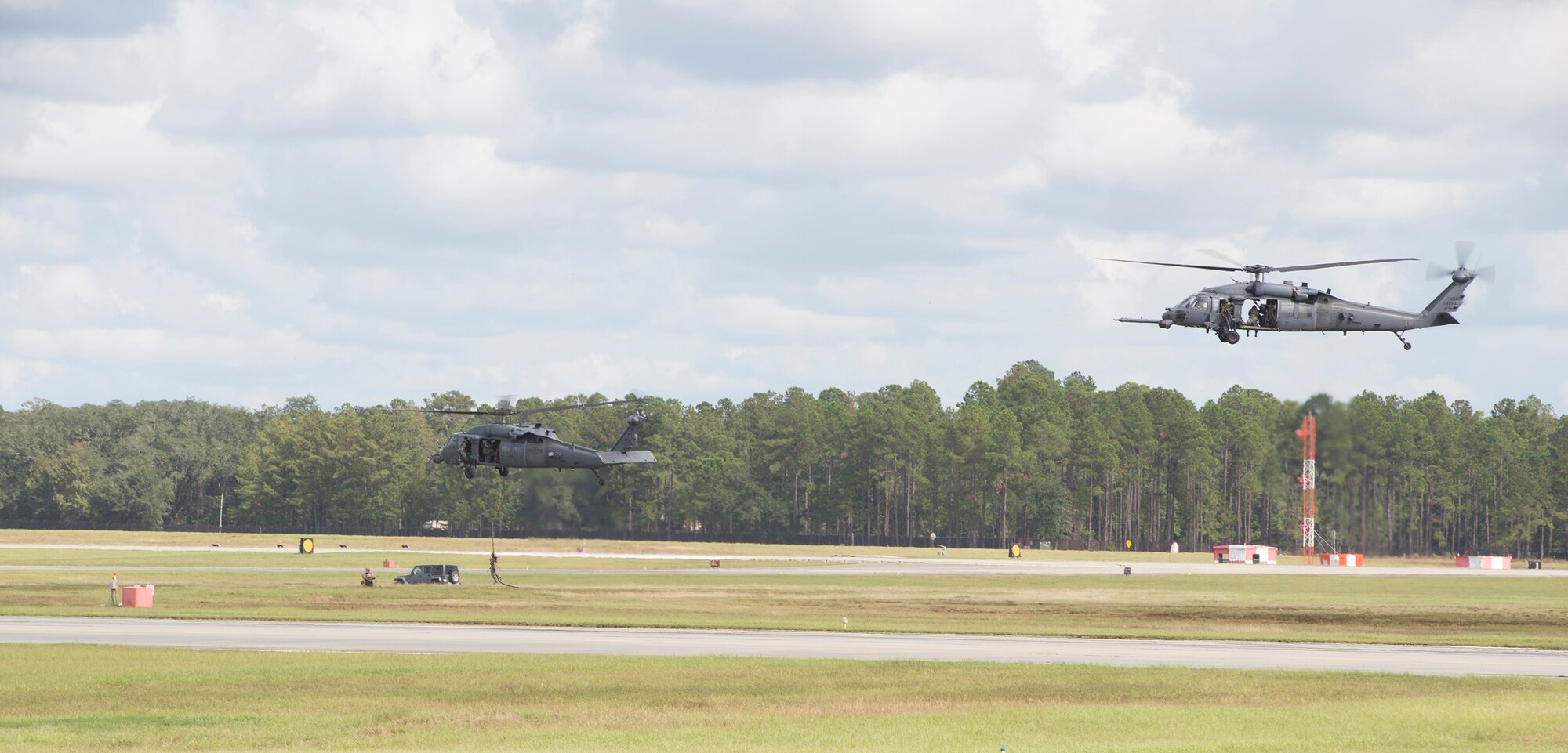 Members of the 820th Base Defense Group utilize two HH-60G Pave Hawks for a combat demonstration during the Thunder Over South Georgia Nov. 7, 2015, at Moody Air Force Base, Ga. The demonstration showed the effectiveness and ability to provide fully-integrated, highly capable and responsive forces to protect Expeditionary Air Forces. (U.S. Air Force photo by Airman 1st Class Greg Nash/Released)