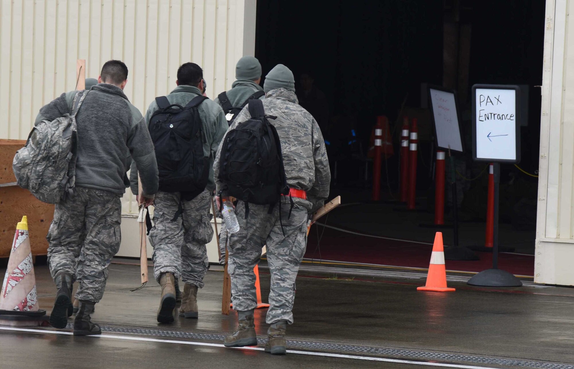 Airmen with the 35th Fighter Wing disembark from a C-130 Hercules at Misawa Air Base, Japan, Nov. 8, 2015. The Airmen returned from Osan Air Base, Republic of Korea, where they participated in exercise Vigilant Ace 16, showcasing the Pacific Air Forces region's primary mission of power projection in the Indo-Asian-Pacific region of responsibility. During Vigilant Ace 16, bases throughout PACAF worked together in support of mock contingency operations abroad. (U.S. Air Force photo by Senior Airman Patrick S. Ciccarone/Released) 