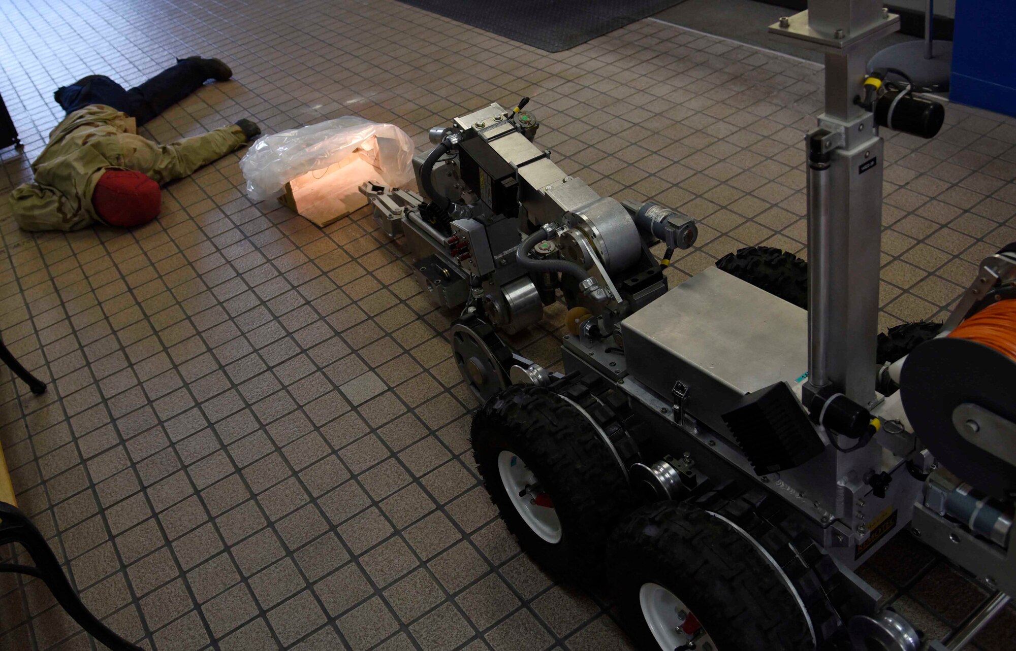 An explosive ordnance disposal F-6A Robot attends to a simulated suspicious package at Misawa Air Base, Japan, Nov. 3, 2015. The emergency management exercise was part of Vigilant Ace 16 to demonstrate the response of different agencies on base. EOD operated their robot to survey the scene and respond accordingly. (U.S. Air Force photo by Airman 1st Class Jordyn Fetter/Released)