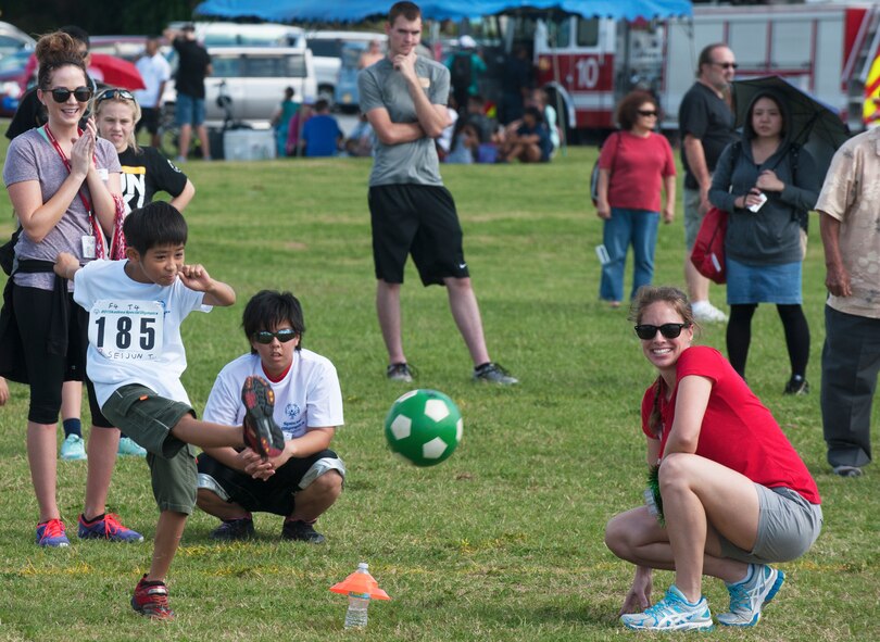 Kadena Special Olympic athlete Seijun Tamaki kicks a soccer ball during the soccer skills event at the Kadena Special Olympics Nov. 7, 2015, at Kadena Air Base, Japan. The KSO is sponsored by the 18th Wing and the Friends of Kadena Special Olympics in partnership with the Okinawa Prefectural Government, Okinawa City, Kadena Town, Chatan Town and all U.S. military services on island. (U.S. Air Force photo by Airman 1st Class Nicholas Emerick)