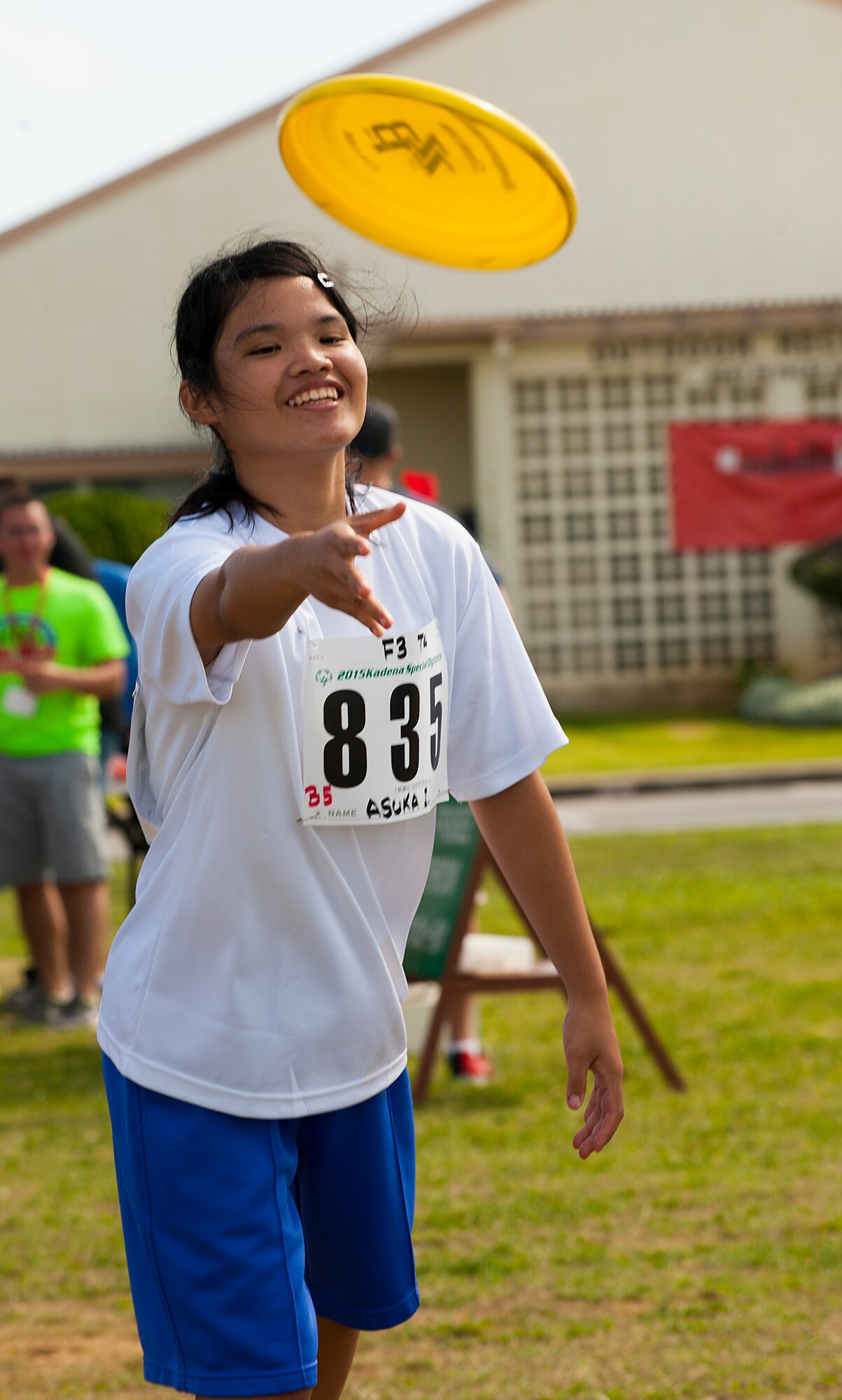 Auska Itoman, Kadena Special Olympics athlete, throws a frisbee during the Kadena Special Olympics Nov. 7, 2015 at Kadena Air Base, Japan. The KSO is sponsored by the 18th Wing and the Friends of Kadena Special Olympics in partnership with the Okinawa Prefectural Government, Okinawa City, Kadena Town, Chatan Town and all U.S. military services on island. (U.S. Air Force photo by Airman 1st Class Corey M. Pettis)