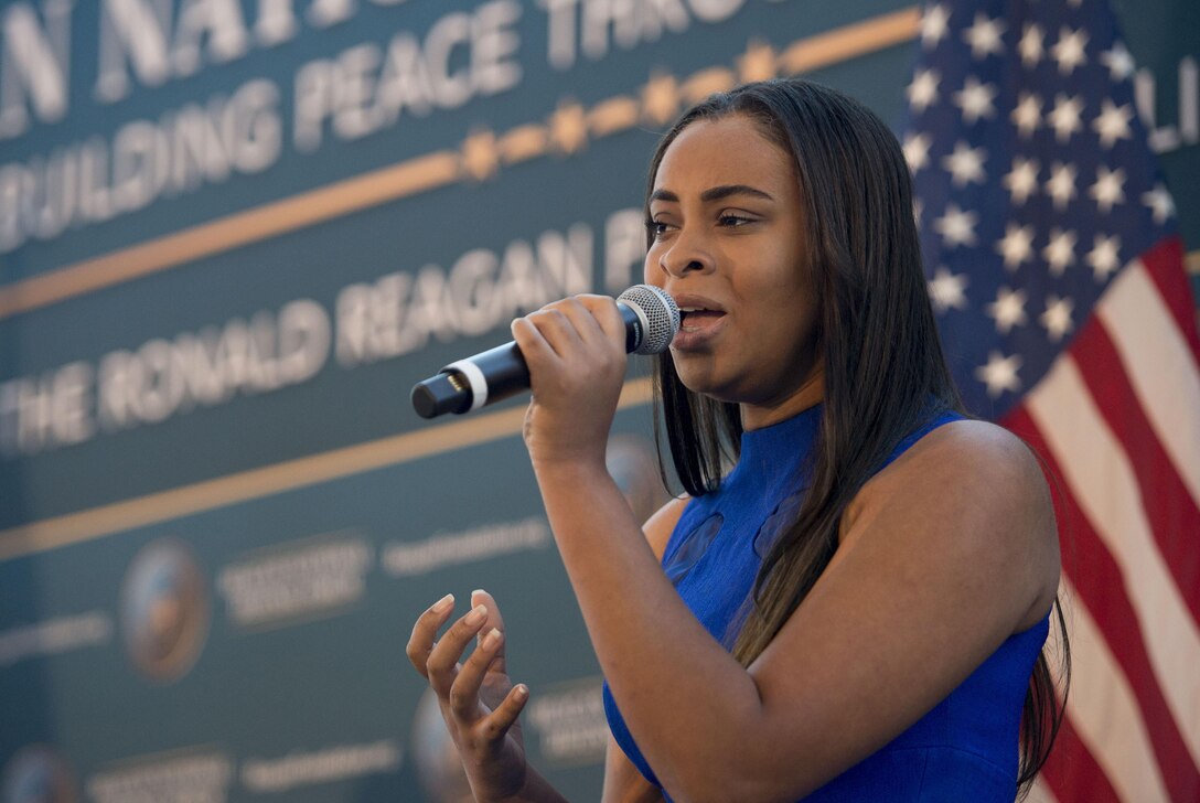 A vocalist sings the national anthem during the Reagan National Defense Forum at the Ronald Reagan Presidential Library in Simi Valley, Calif., Nov. 7, 2015. DoD photo by Air Force Senior Master Sgt. Adrian Cadiz
