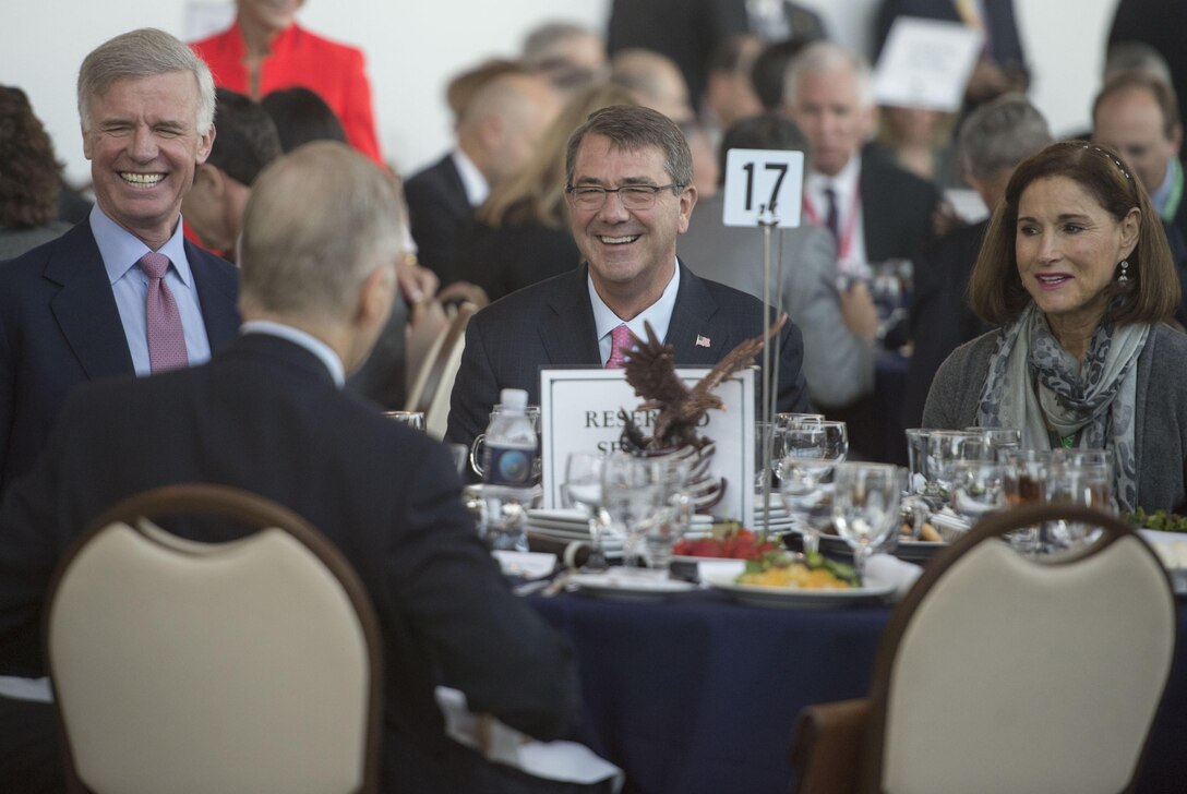 Defense Secretary Ash Carter shares a light moment with guests as he prepares to deliver keynote remarks at the Reagan National Defense Forum in Simi Valley, Calif., Nov. 7, 2015. DoD photo by Air Force Senior Master Sgt. Adrian Cadiz