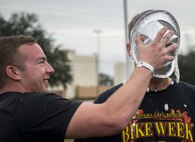An Airman receives a pie in the face from his “wingman” during the the Duke Field Wing Day event Nov. 7.  The 919th Special Operations Wing sets aside a special day each year to show appreciation for its reservists and their family members. Events included music, sports, children’s games, etc. (U.S. Air Force photo/Tech. Sgt. Cheryl Foster)